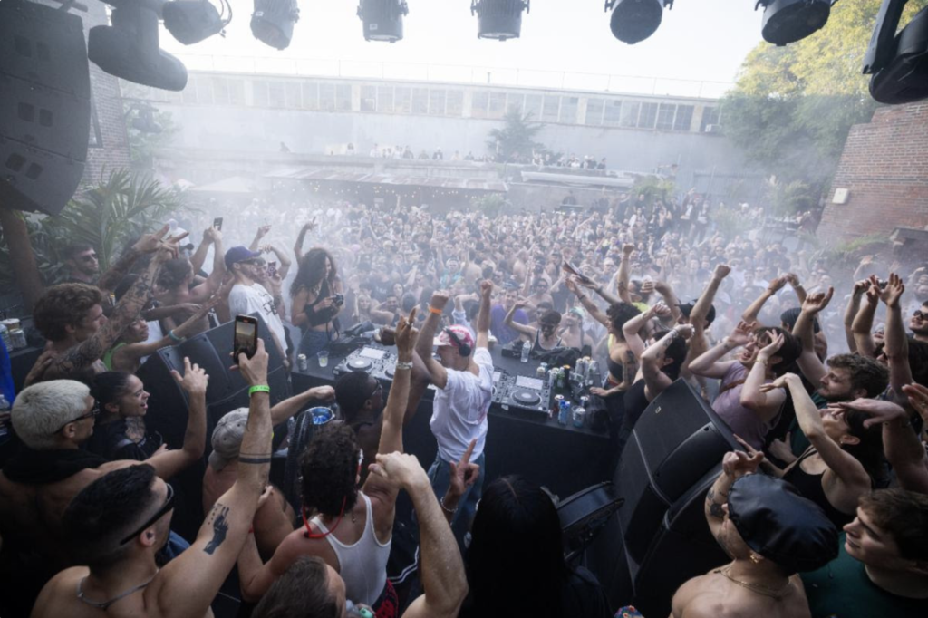 Crowd dancing at The Ruins stage during WIRE Festival at Knockdown Center, NYC